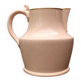 Antique pitcher in pink ceramic