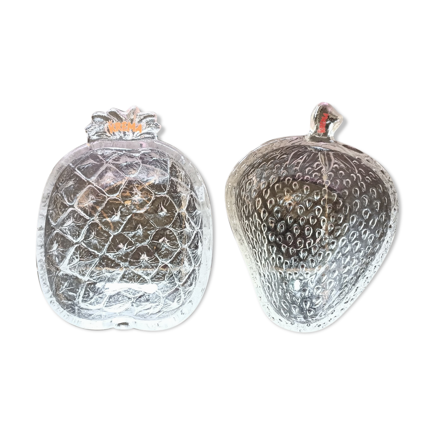 Two molded glass cups in the shape of strawberry and pineapple