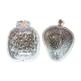 Two molded glass cups in the shape of strawberry and pineapple