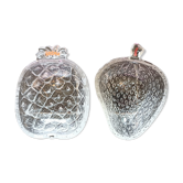 Two molded glass cups in the shape of strawberry and pineapple