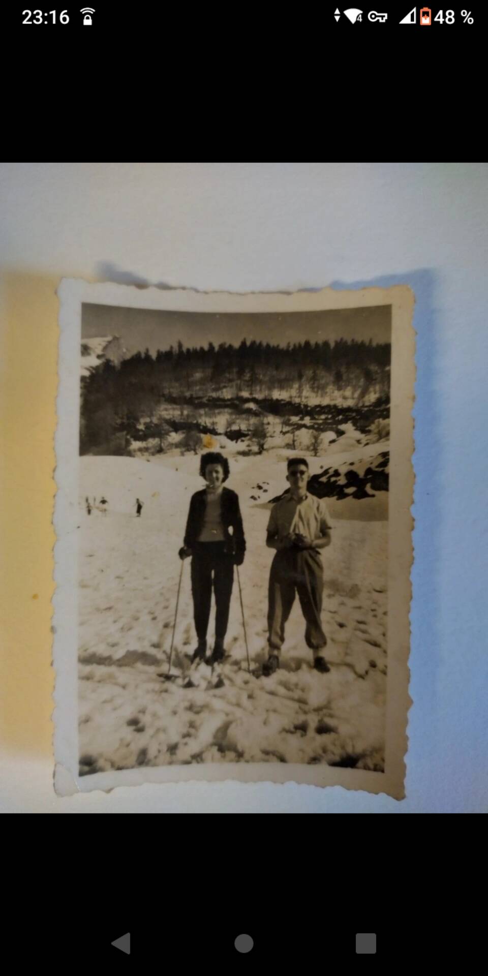 Framed vintage photograph of skiers.