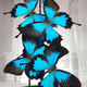 Blue emperor butterflies under large glass dome