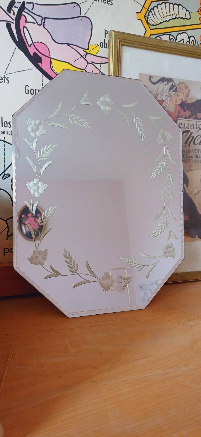 Beveled mirror with floral decor