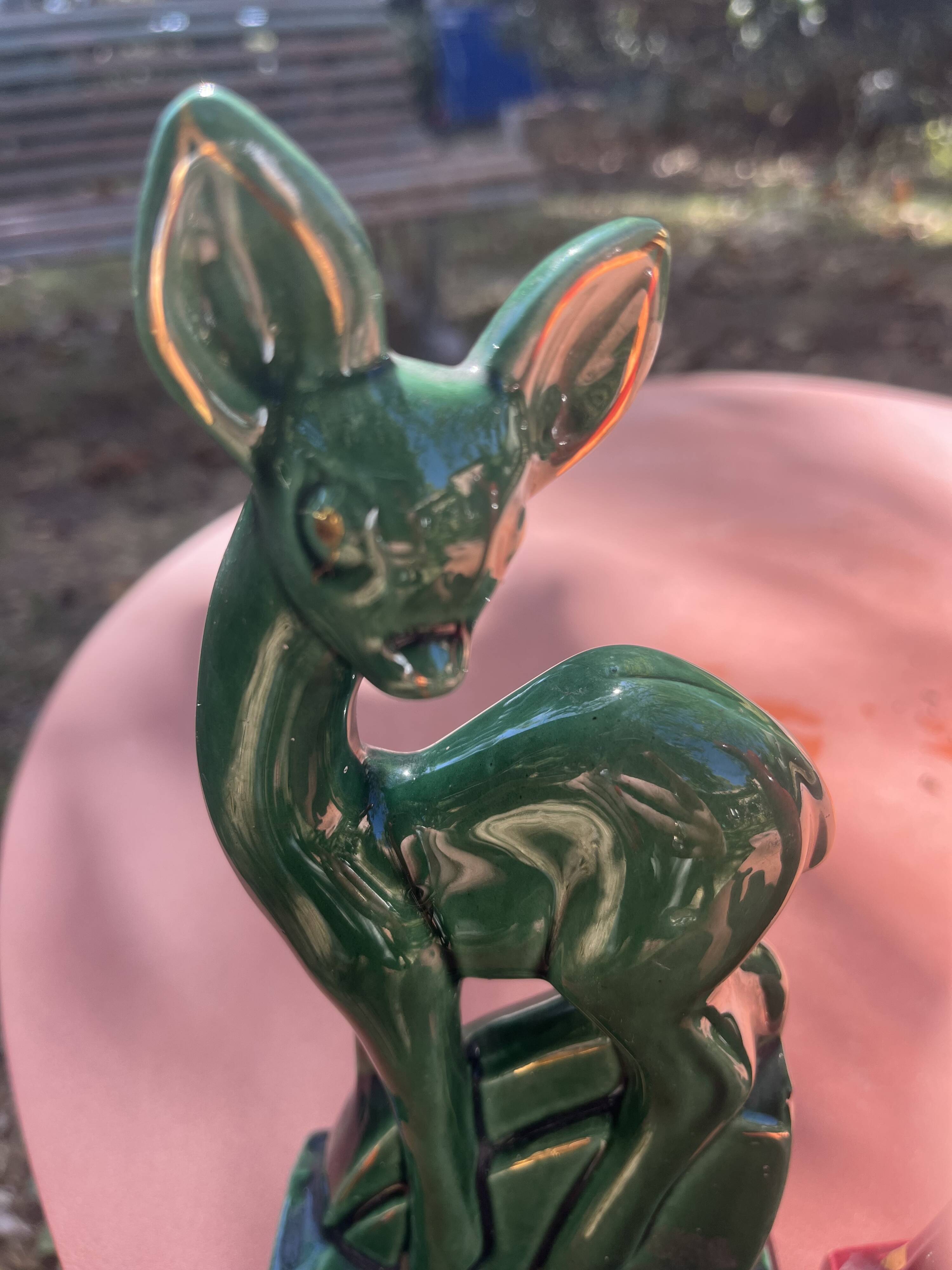 Pair of Art Deco deer by Charles Lemanceau in red and green ceramic.