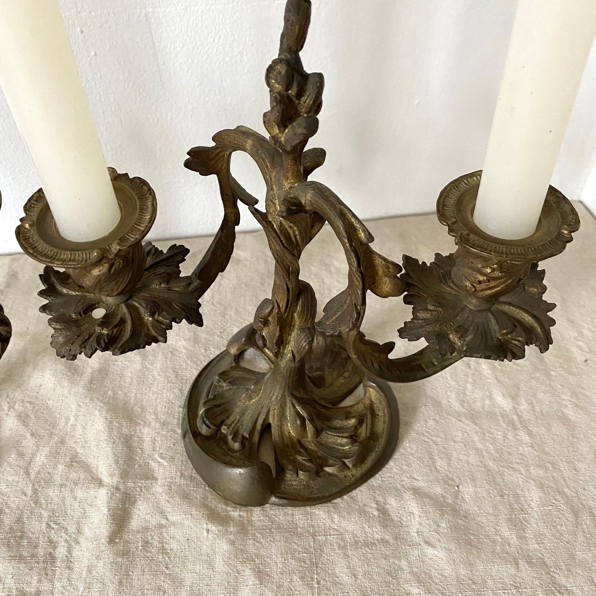 Pair of antique bronze candlesticks at the end of the table XIXth