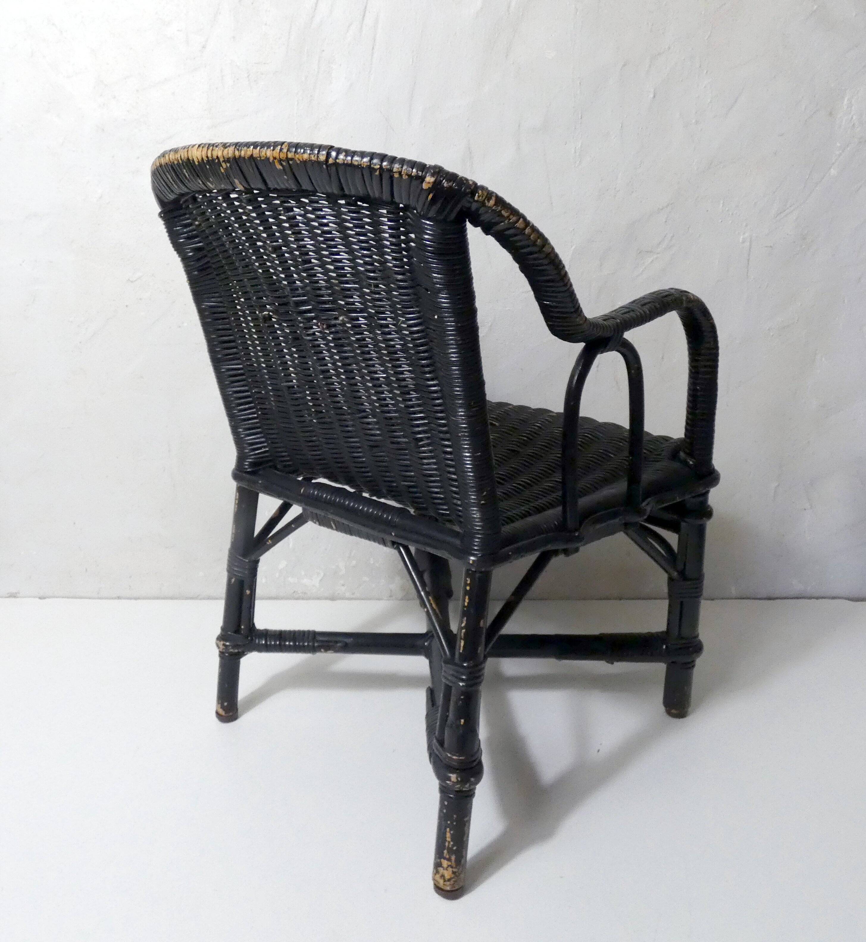 Vintage children's size rattan armchair