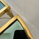 Table basse néoclassique en laiton et verre fumé, 1970