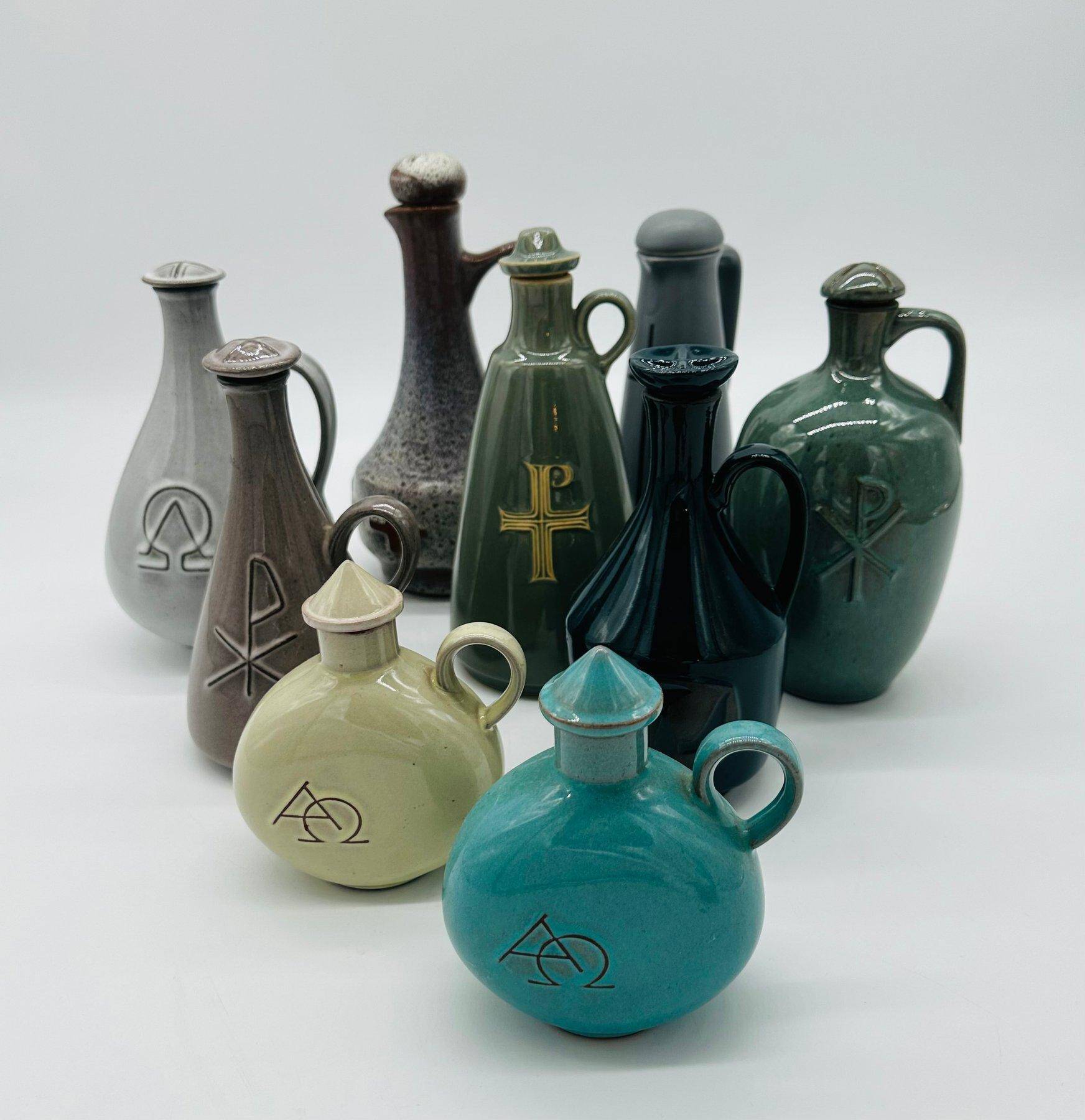 Set of nine modern sculptural ceramic vases from the mid-century, Bauhaus influence.