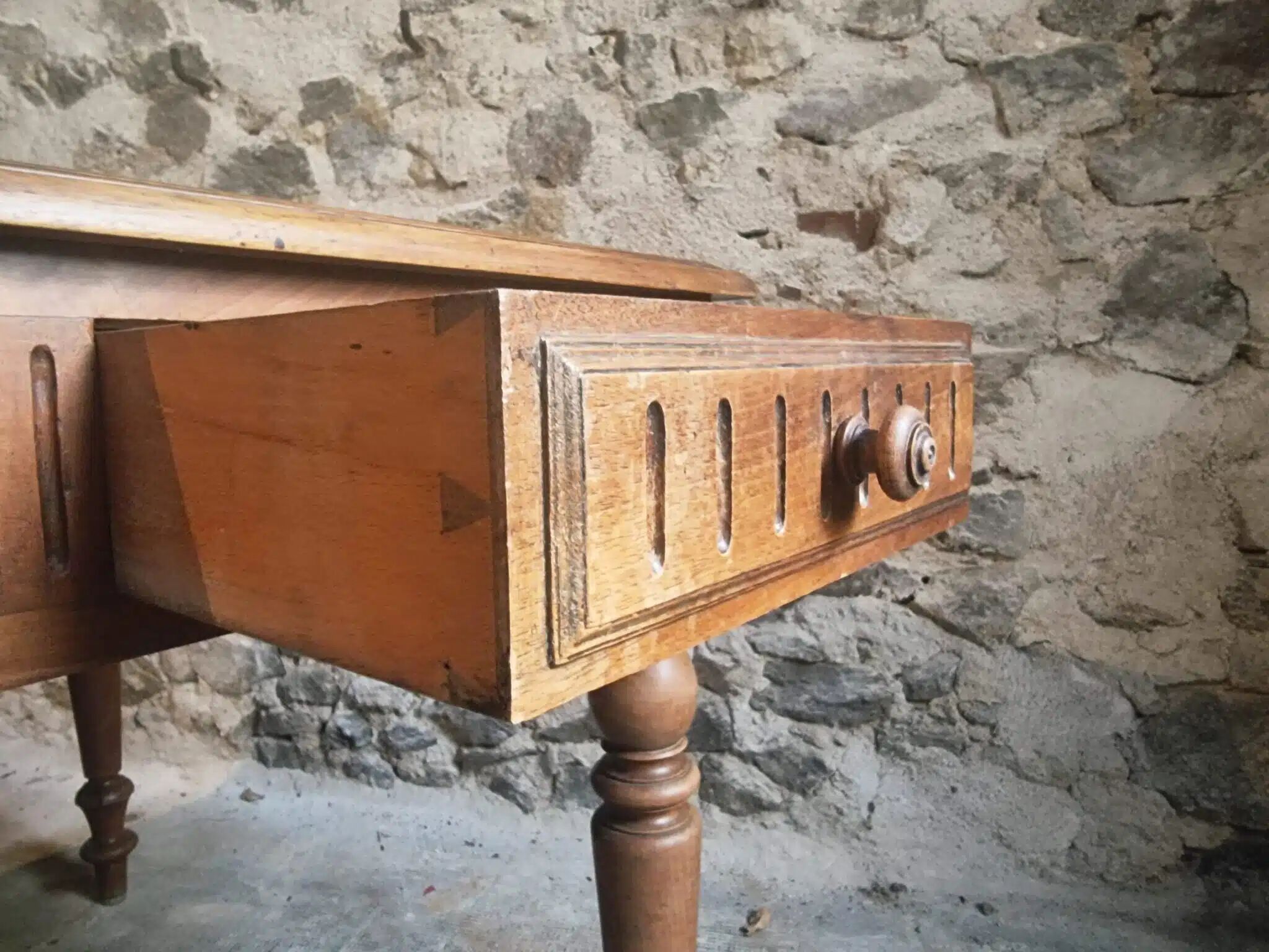 Antique French walnut table with six drawers, parquet top, early 20th century.