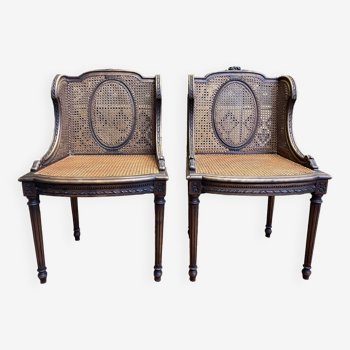 Paire de fauteuils bergères style Louis XVI en cannage