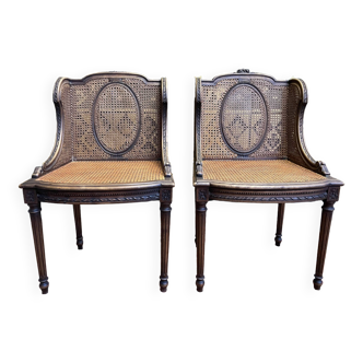 Paire de fauteuils bergères style Louis XVI en cannage