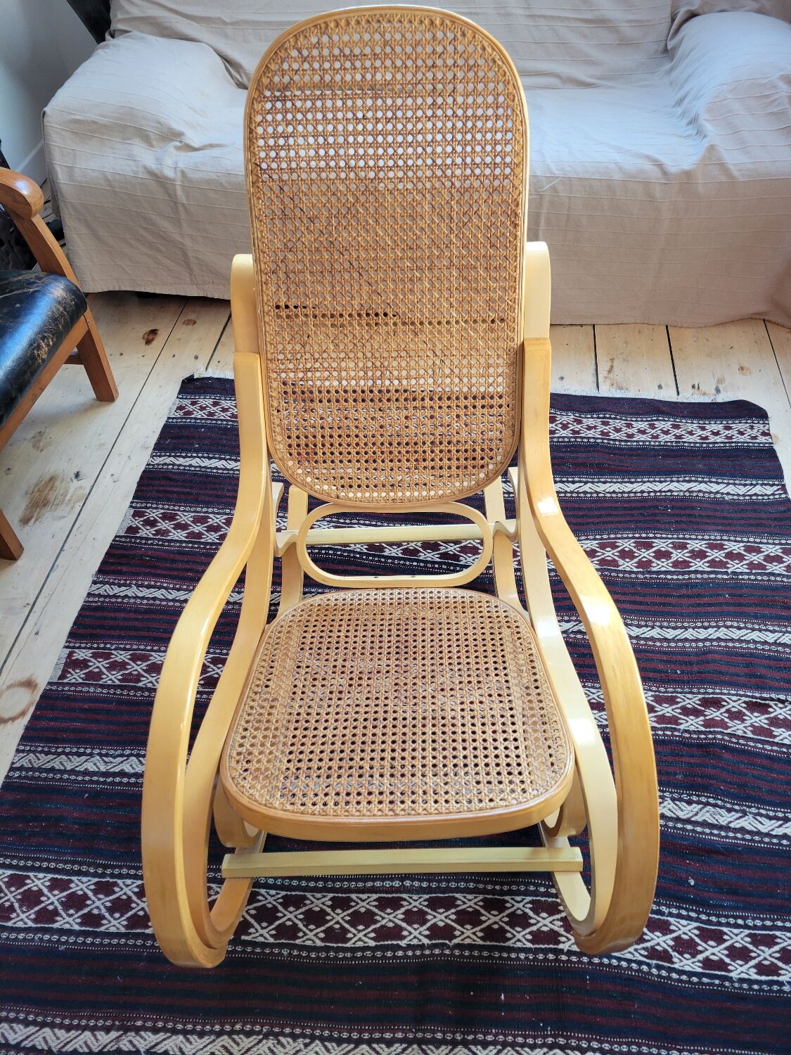 Rocking chair in arched wood and cane