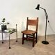 Spanish chair in leather and carved wood, 1950s/60s.