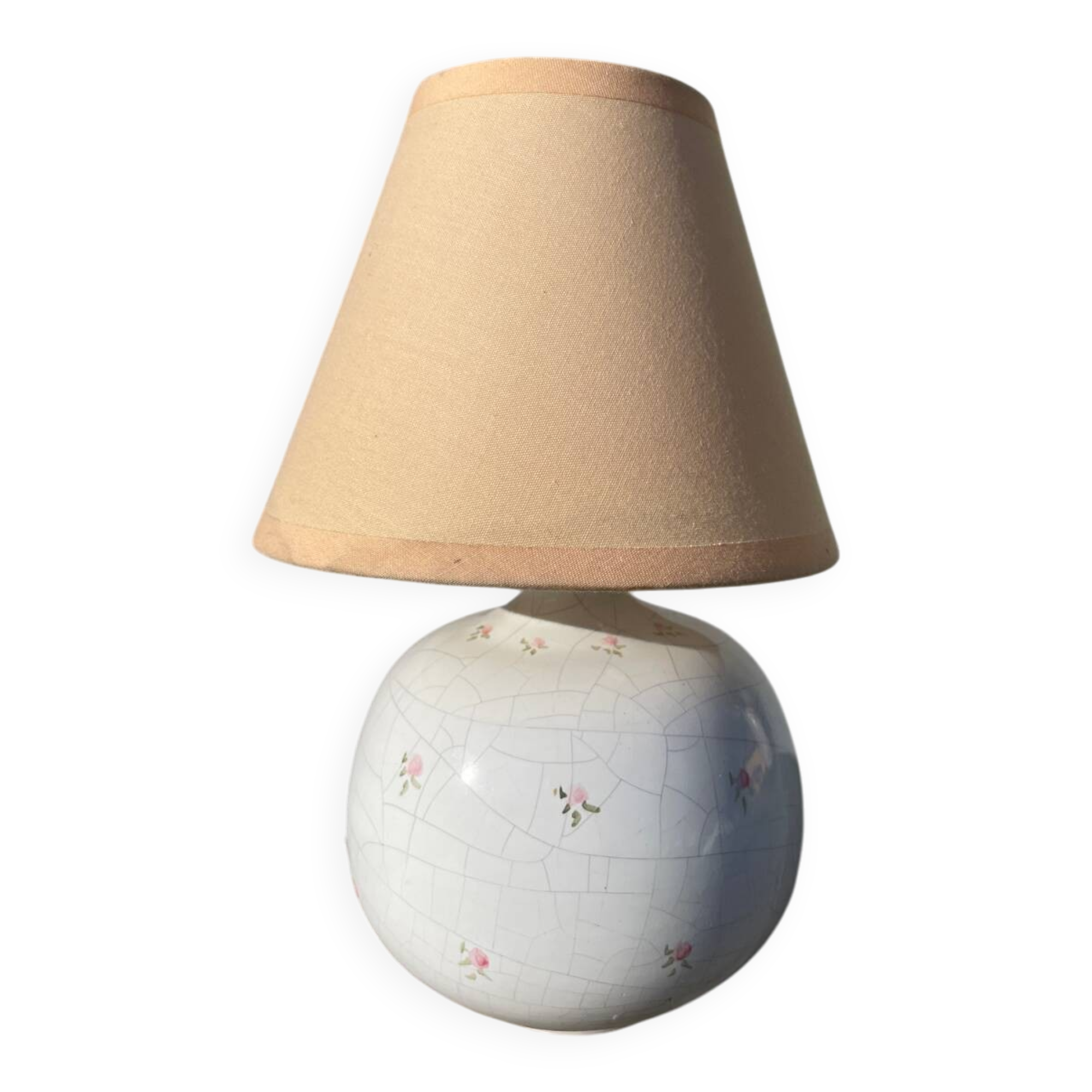 Small cracked white ceramic lamp with flowers.