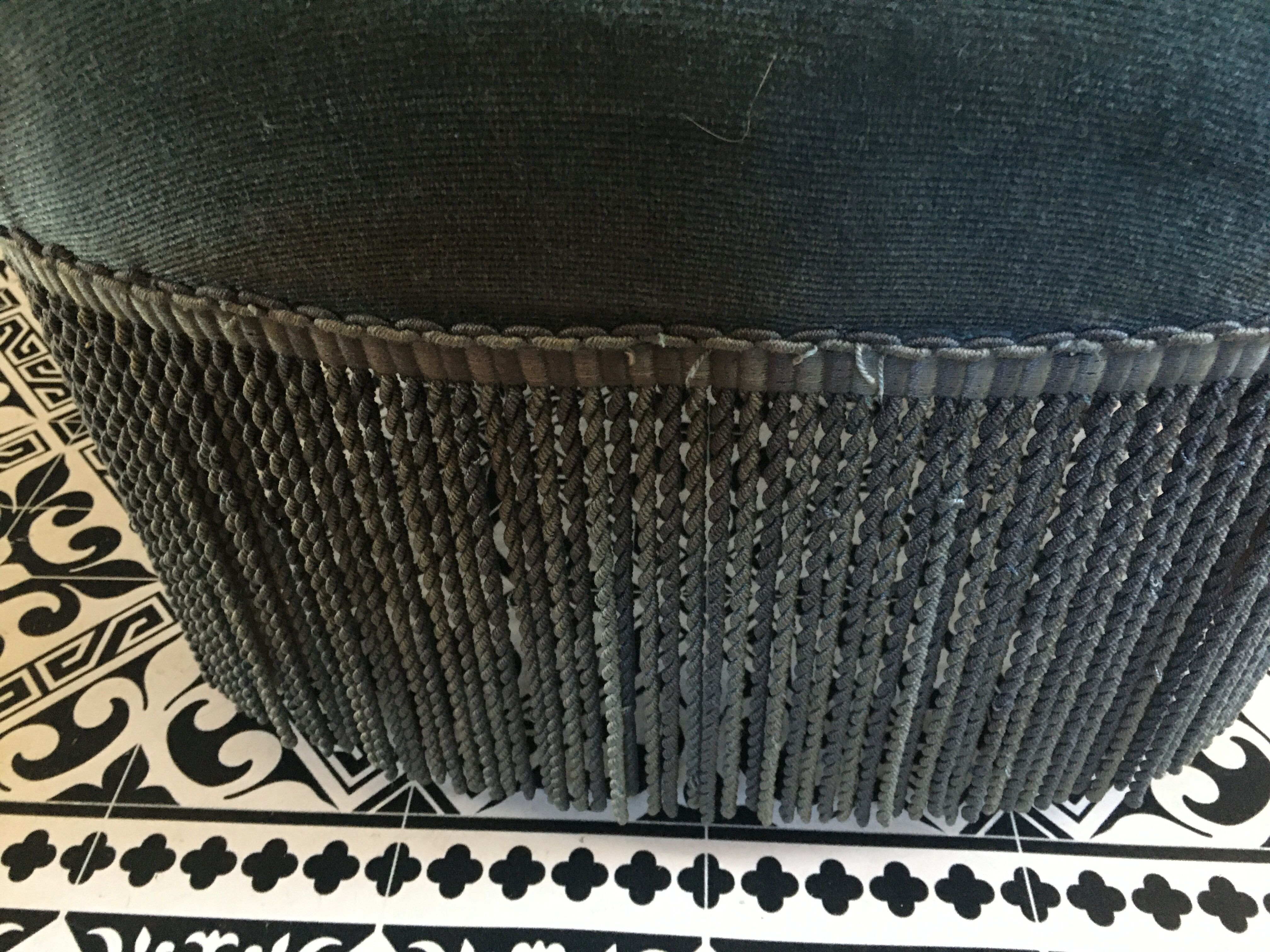 Blue heater with fringed medallion shape