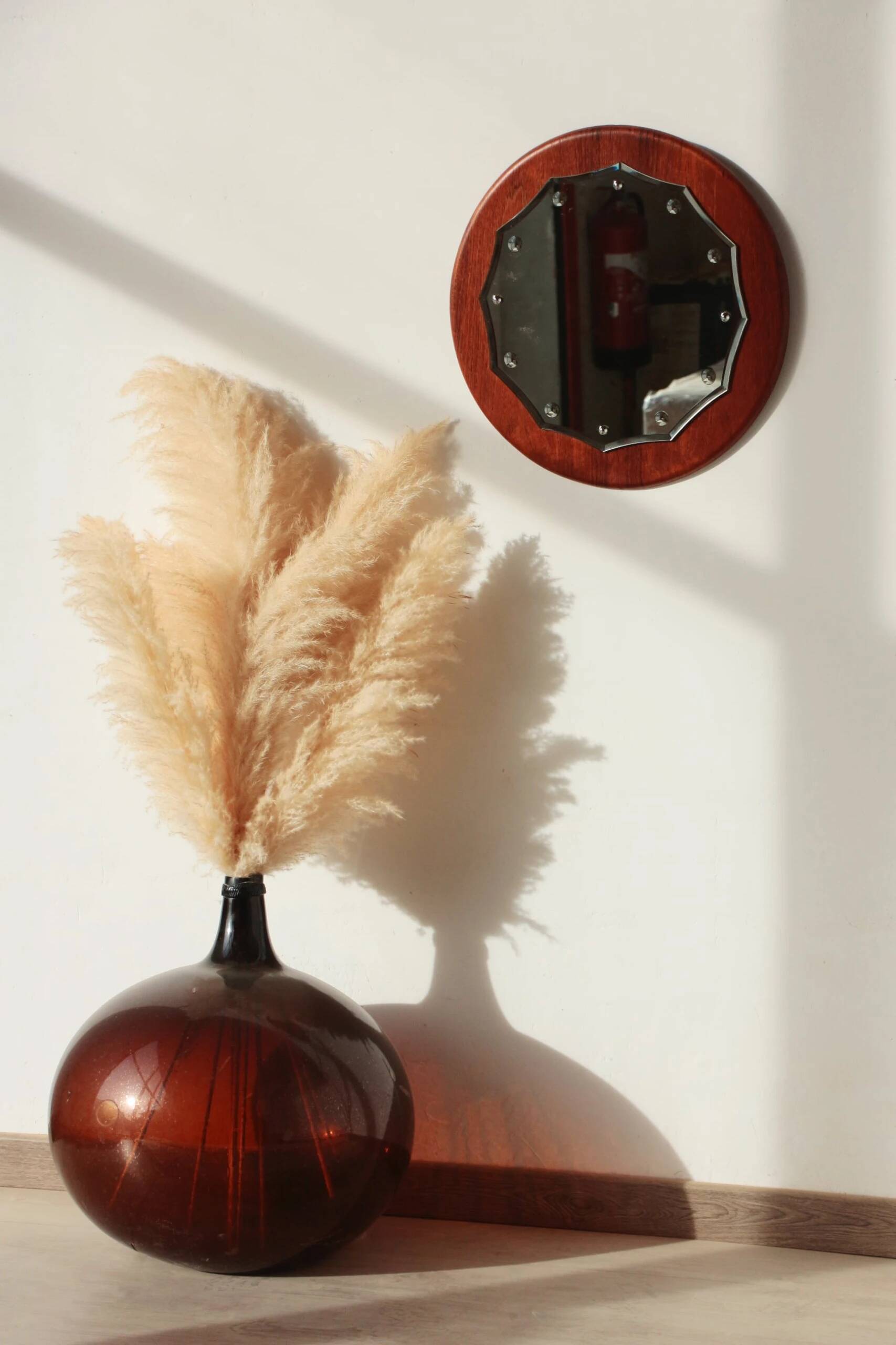 Vintage round teak mirror from the 1960s.