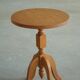 Pair of Scandinavian oak side tables with central legs and sculptural curved feet, 1960s.