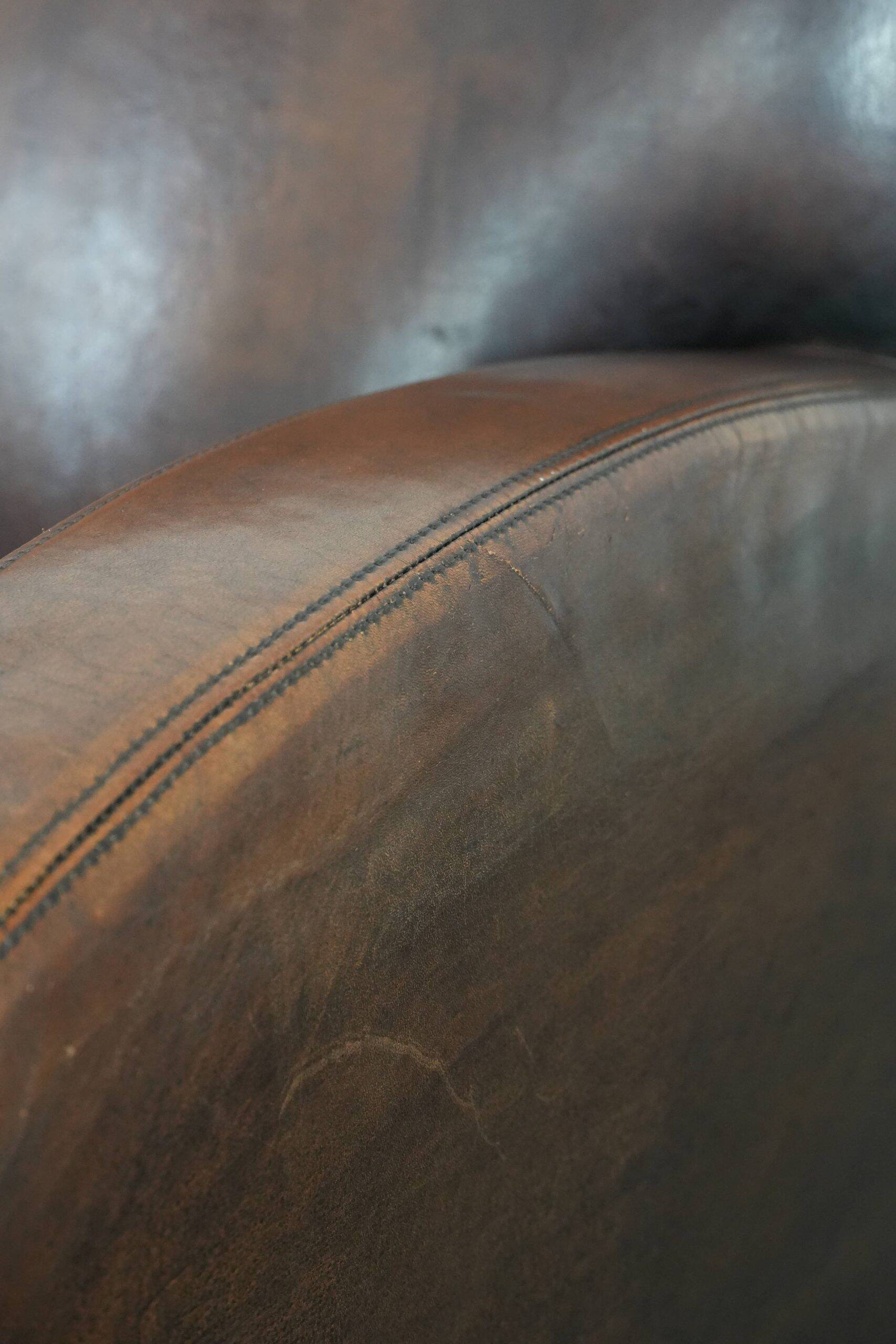 Beautifully shaped vintage sheepskin armchair with character