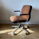 Swivel office chair with casters