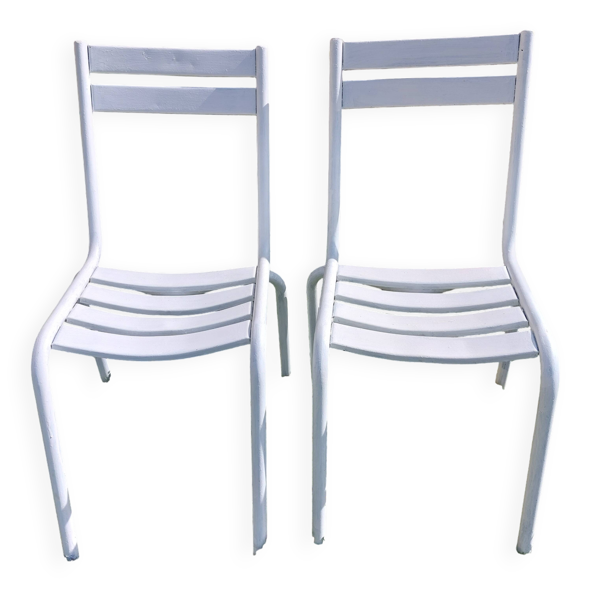 pair of white metal chairs, Tolix style