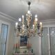 Lustre à bougies en fer forgé avec fleurs