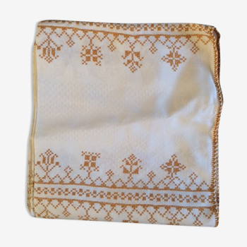 Damask tablecloth with golden patterns