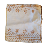 Damask tablecloth with golden patterns