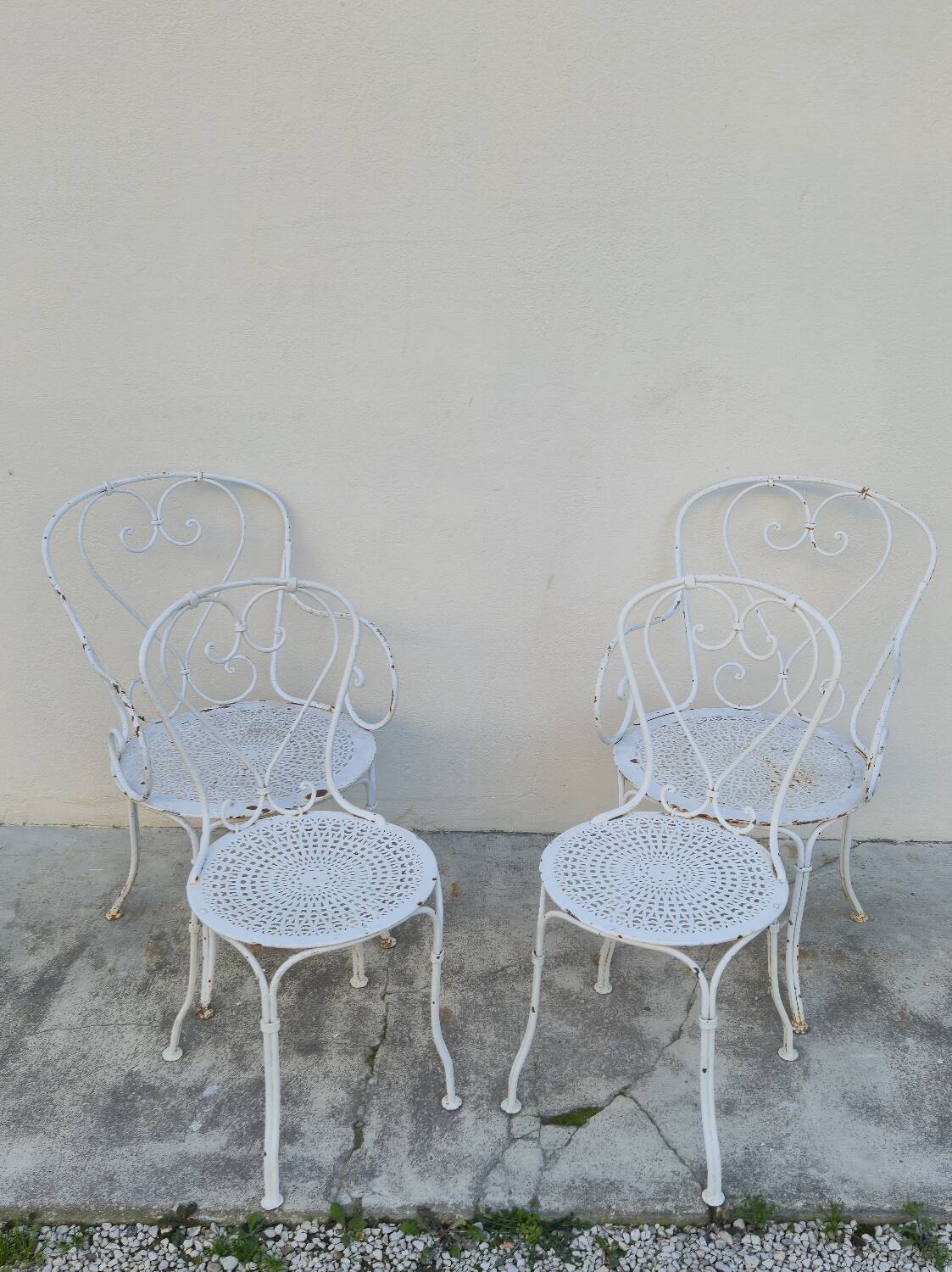 Garden furniture, two armchairs and two wrought iron chairs, period 1