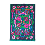 Handwoven colorful Romanian carpet, green and black background with gorgeous colorful flowers