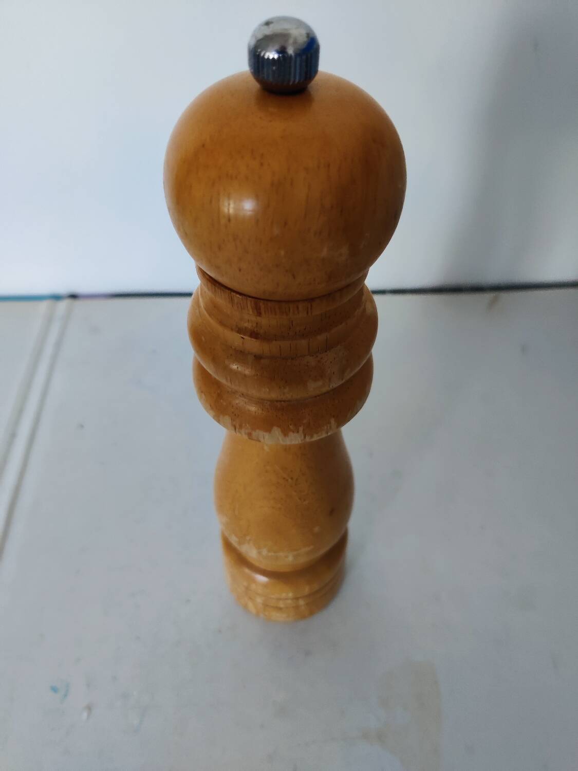 Turned wooden pepper mill