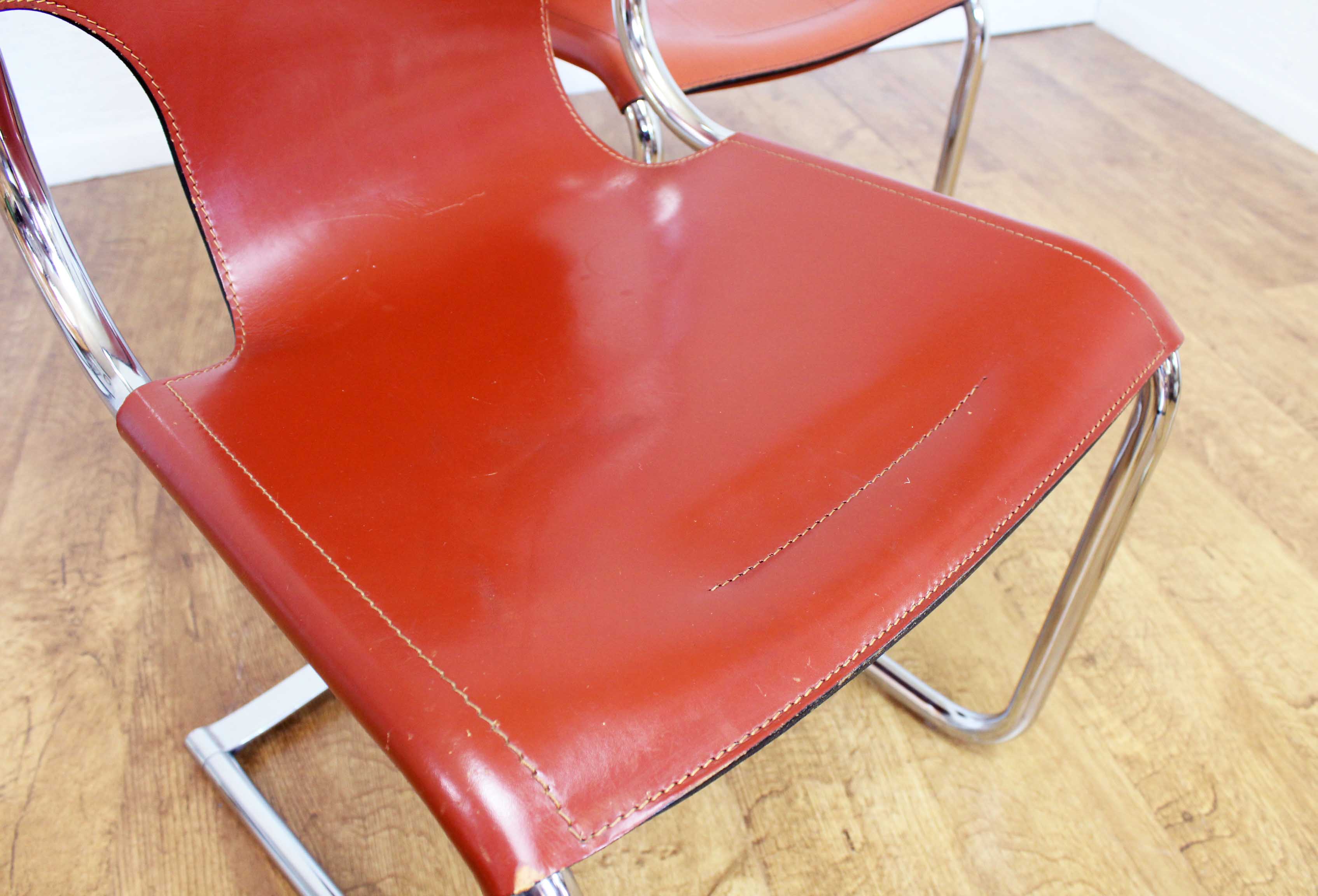 Pair of chairs in leather and chrome tube