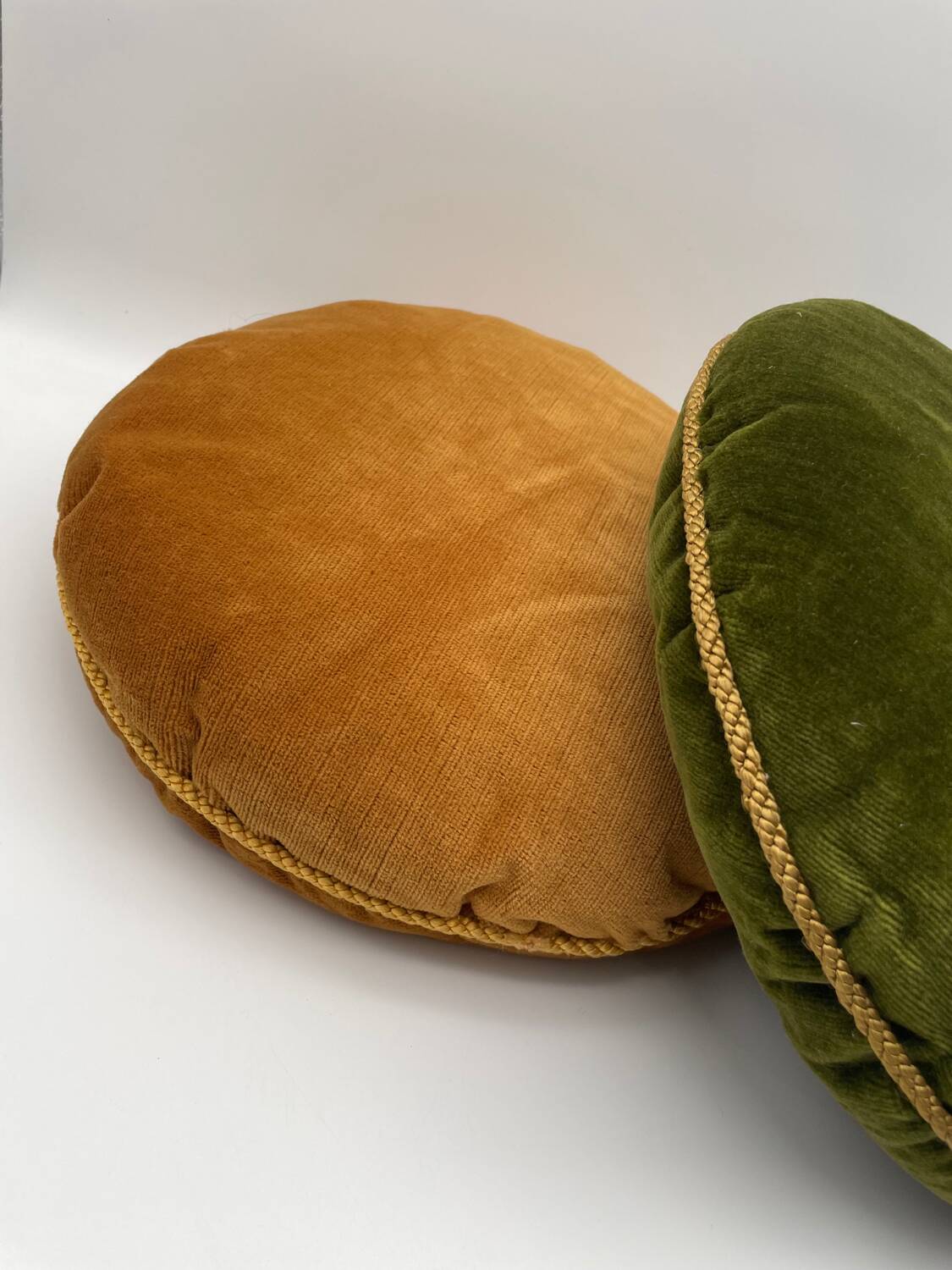 Pair of vintage round velvet cushions