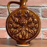German round vase with floral motif, ornamental brown ceramic jug with handle