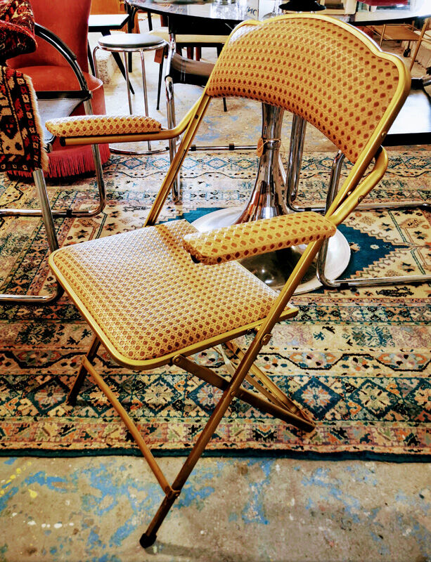 Folding gold arm chair