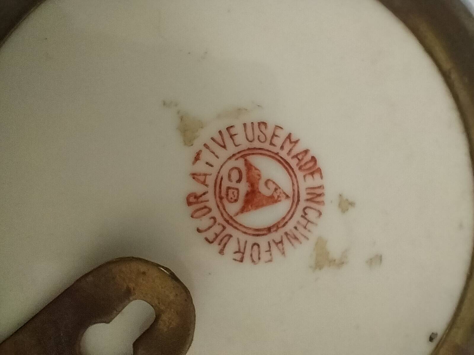 Pair of vintage Chinese decorative plates with floral decoration on a yellow background