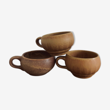 Three cups made of ancient sandstone