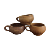 Three cups made of ancient sandstone
