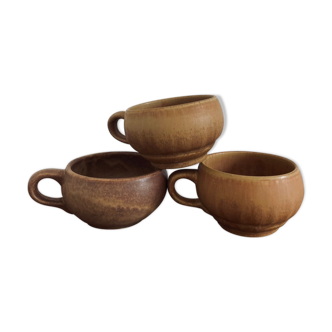 Three cups made of ancient sandstone