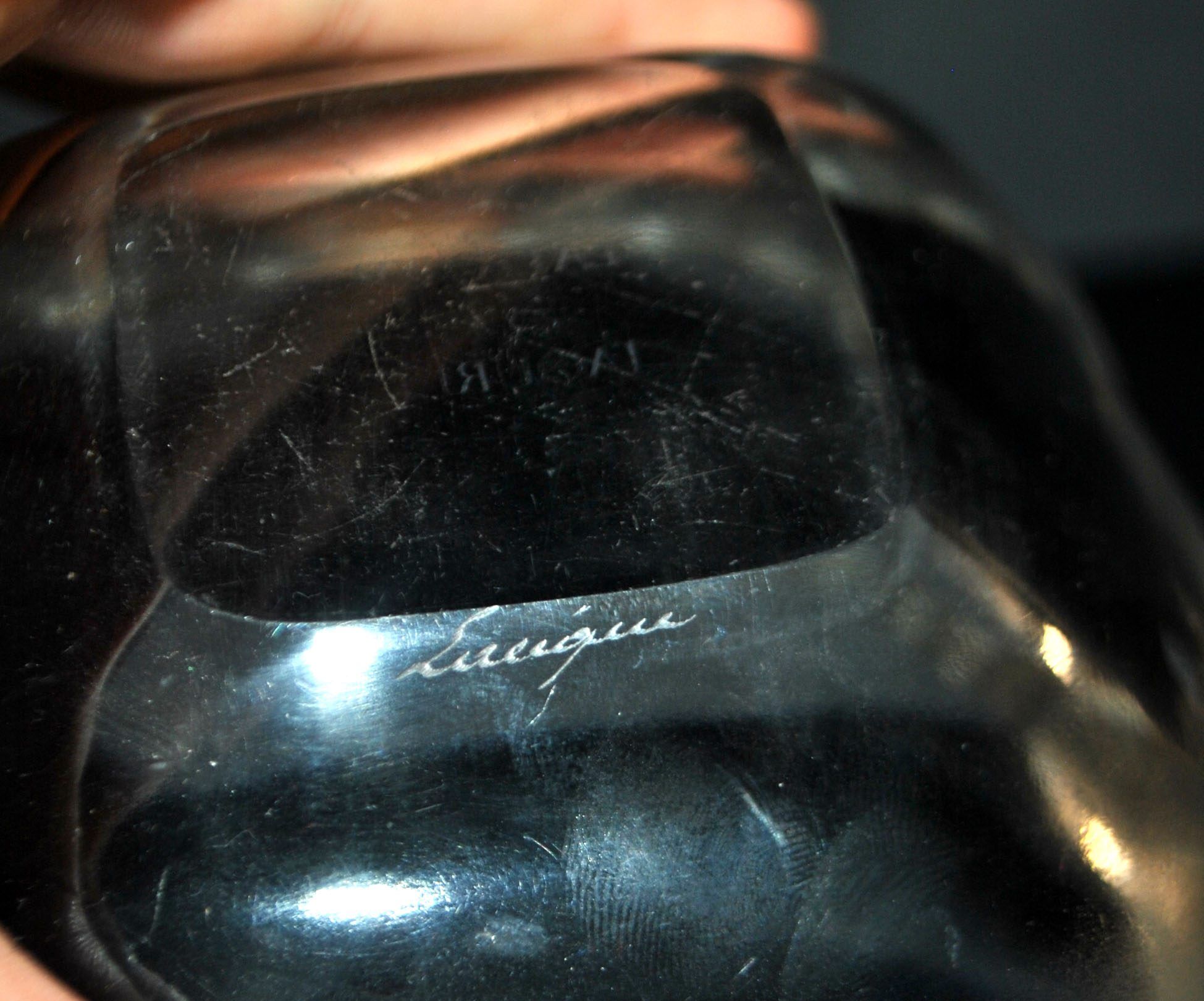 Lalique glass ashtray bowl with frosted finish, engraved with wave design, signed Lalique.