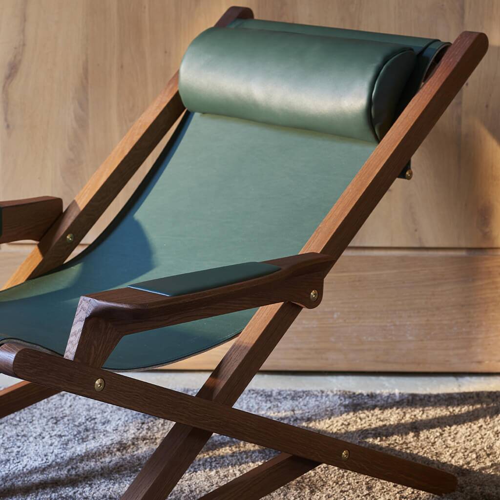 Oak and leather lounge chair designed by Emile DUVIVIER