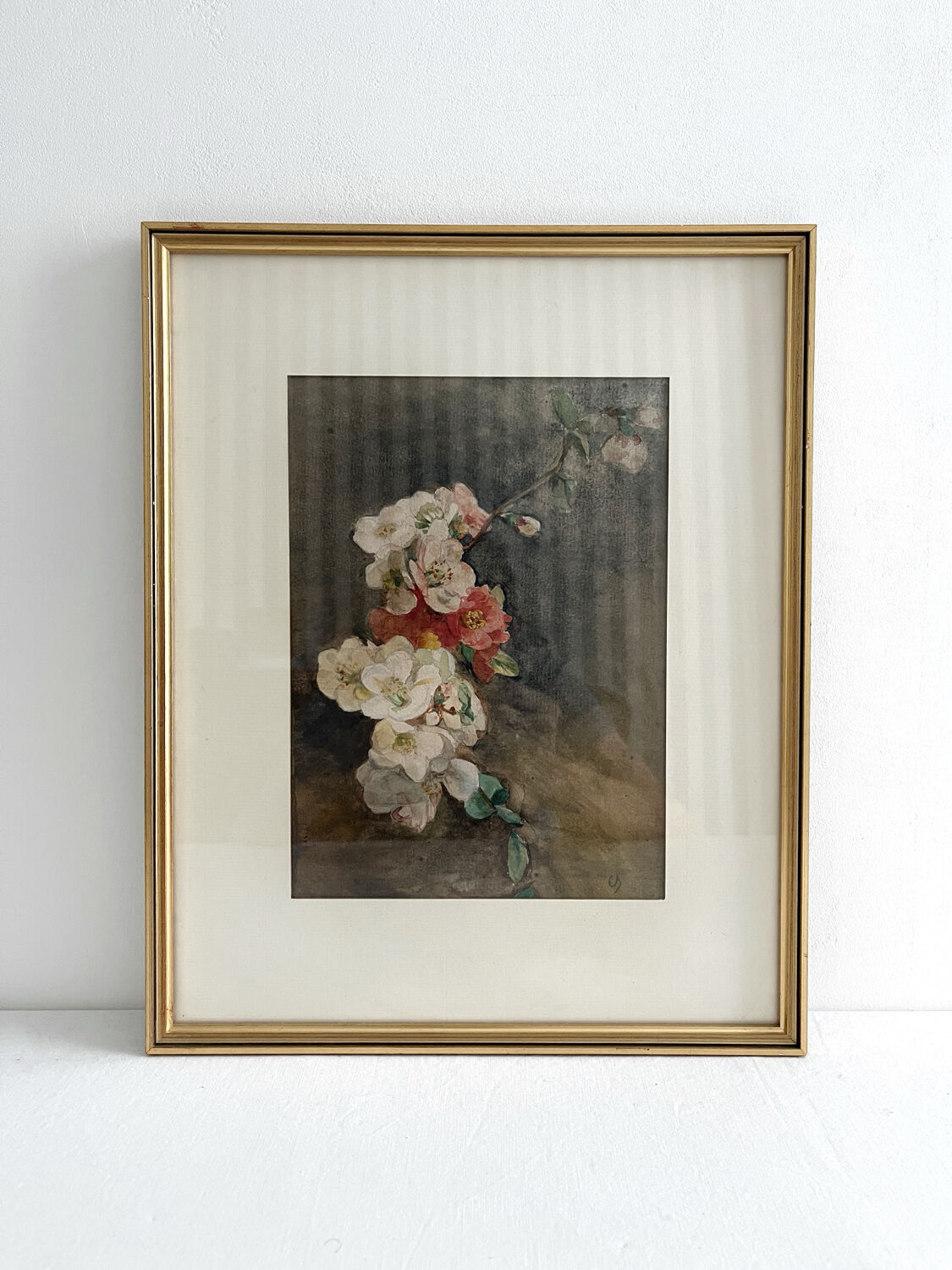 Old watercolour and gilded frame with cherry blossoms.