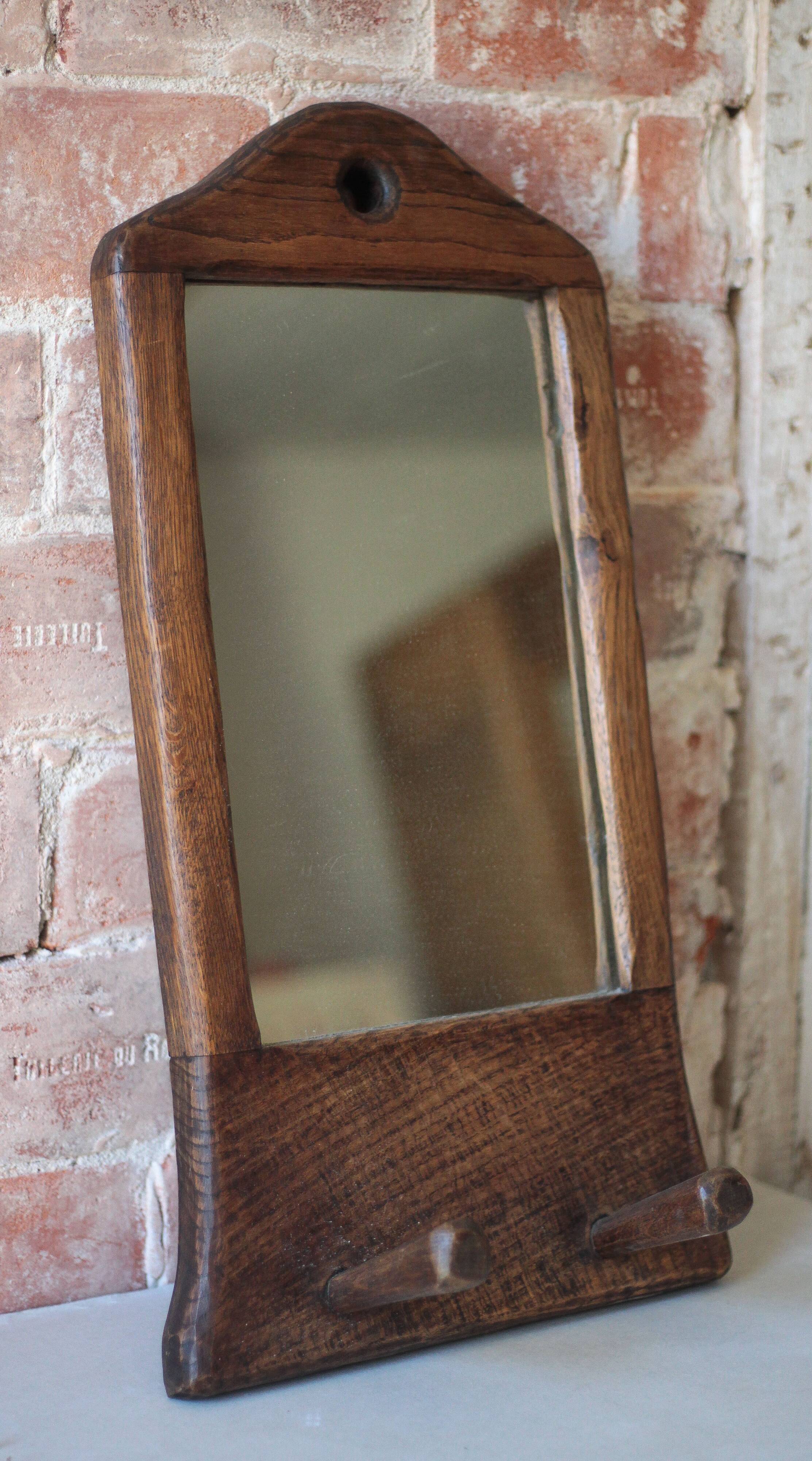 Wall-mounted coat rack mirror with solid wood hooks, brutalist mirror.