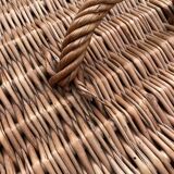 Old wicker basket with closure and handle