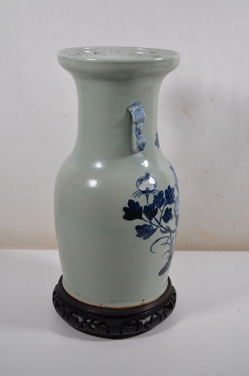 China. Porcelain mallet vase with blue and white phoenix decoration on a rock.