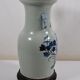 China. Porcelain mallet vase with blue and white phoenix decoration on a rock.