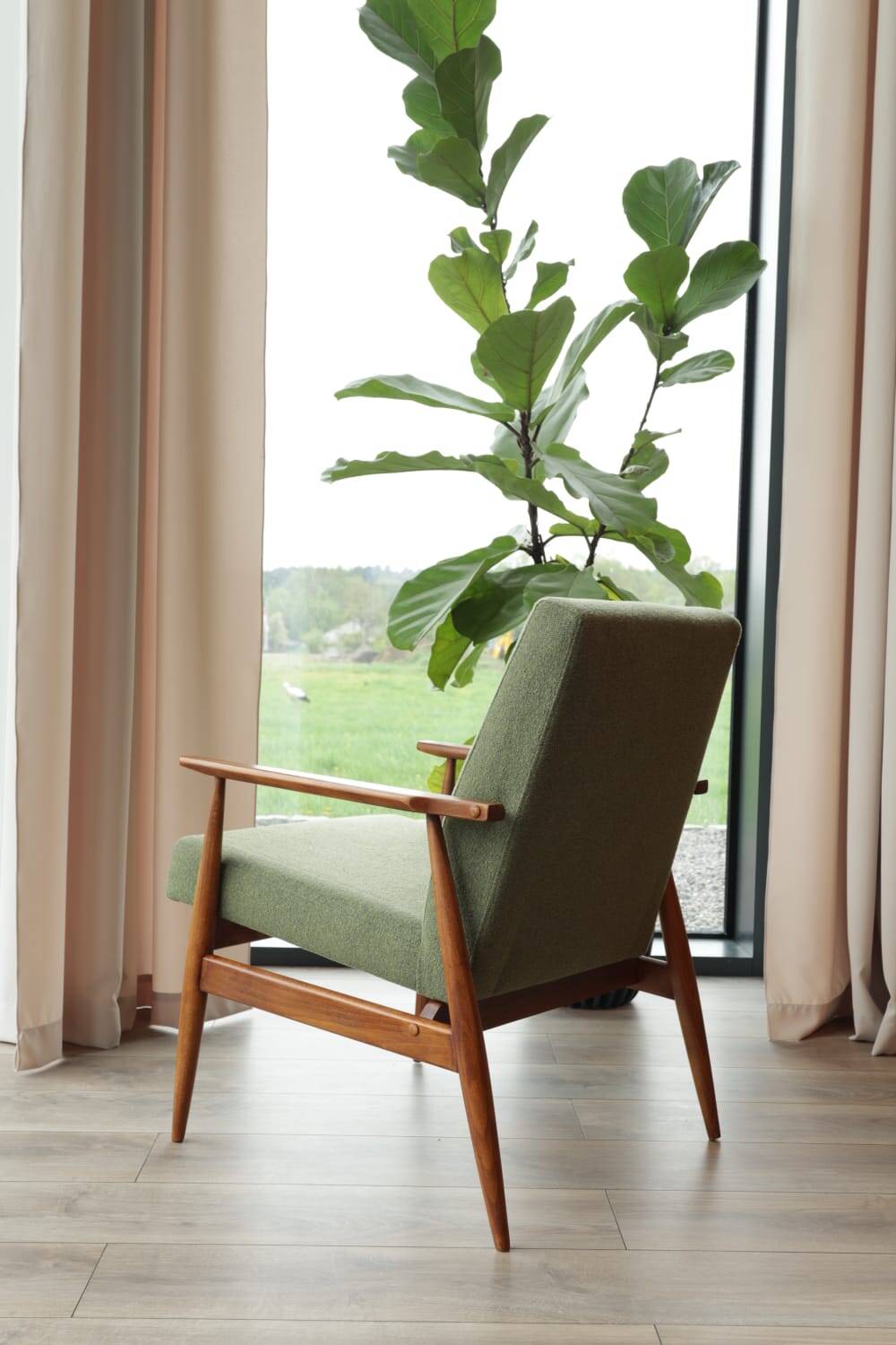 Vintage armchair in swamp green bouclé design by H. Lis.