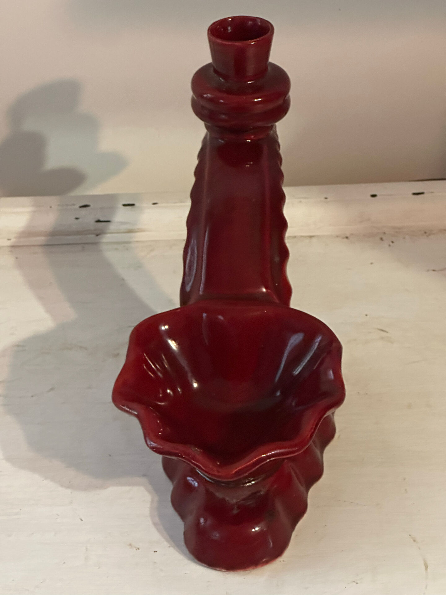 Ruby red ceramic pocket ashtray from Vallauris, numbered.
