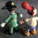 Set of 2 vintage GOULA wooden toy figurines with spring.