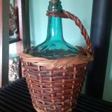 Glass bottle in its wicker dress