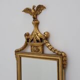 20th Century gilded wooden Empire style mirror with eagle on top